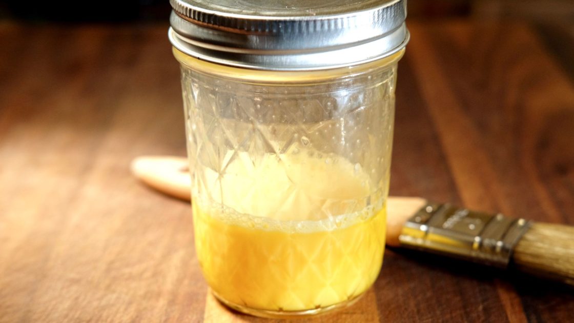 Egg Wash in glass jar with pastry brush in background