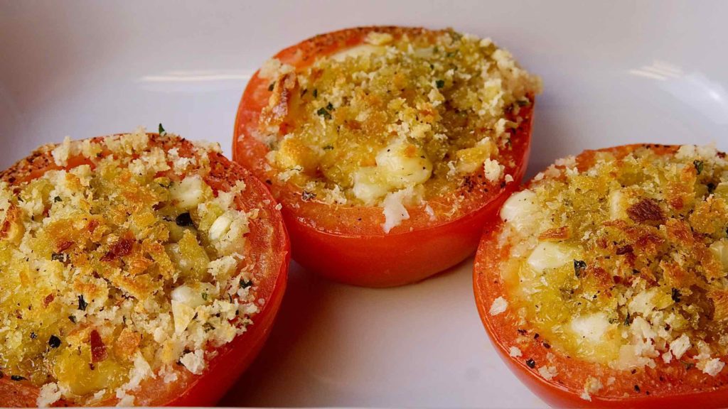 Stuffed Herb Tomatoes in baking dish, fresh out of the oven.