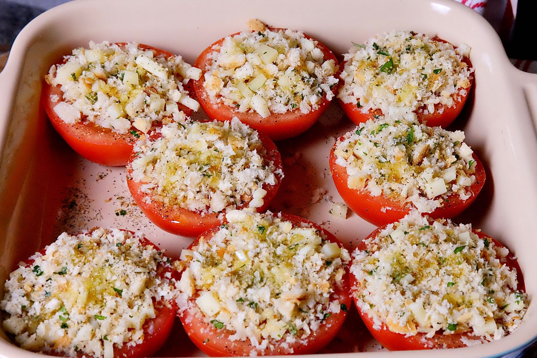 Stuffed Herb Tomatoes in baking dish ready to go into the oven.