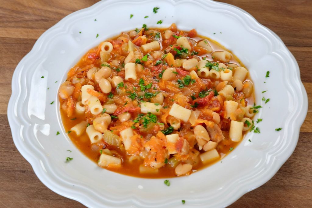 Pasta E Fagioli in White Soup Bowl on Wood Board