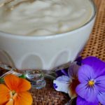 Vanilla Pudding with Almond Milk and pansies in foreground