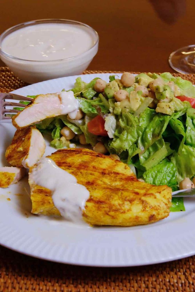 A light Mediterranean meal of mixed greens served with Greek sauce and grilled chicken marinated with Mediteranean spices
