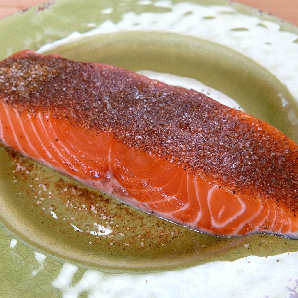 Pan Seared Barbecue Salmon on dish with rub seasoning