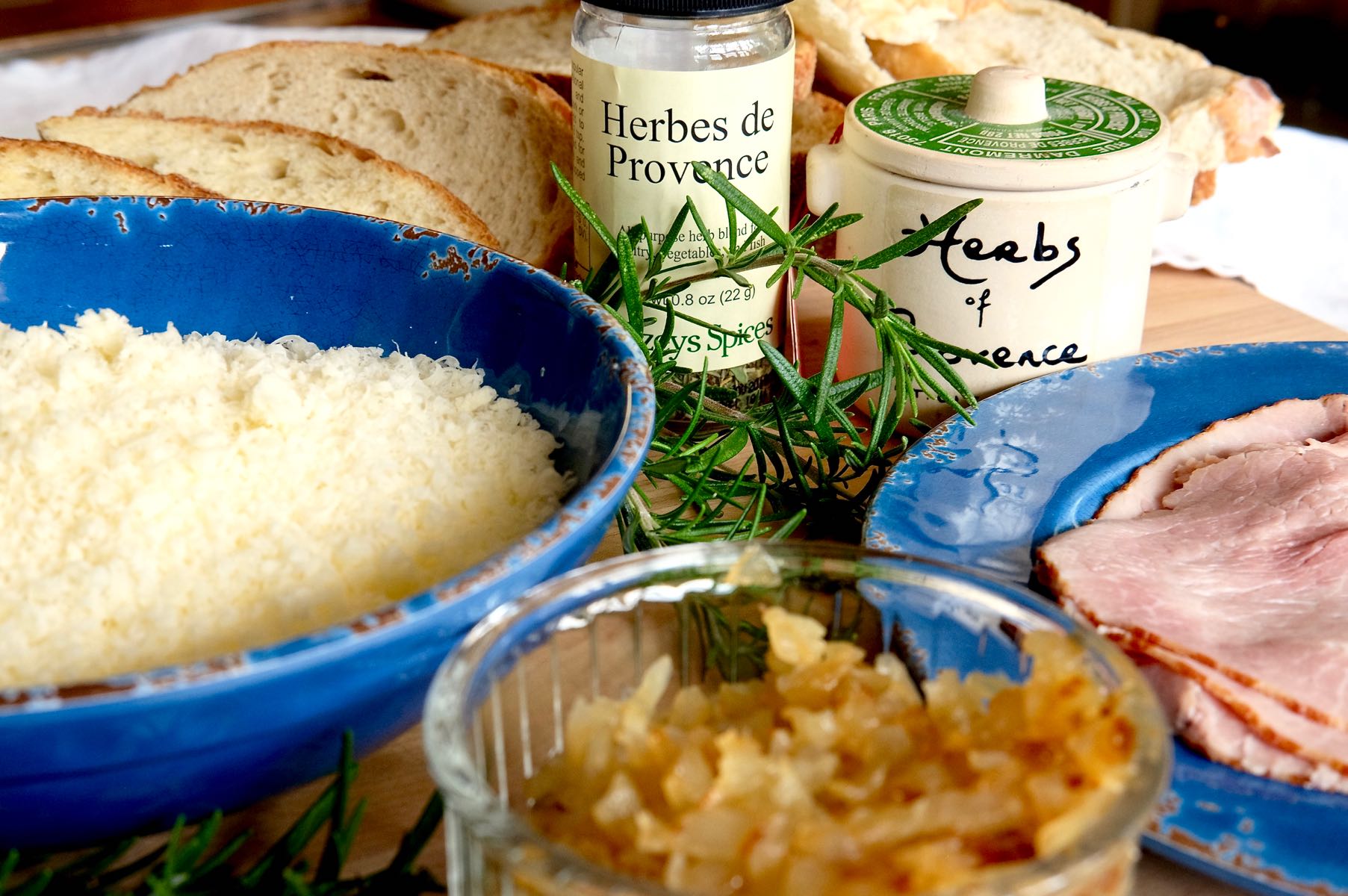 Ingredients: Gruyere cheese, caramelized onions, Herbes de Provence, sliced bread and a dish of ham