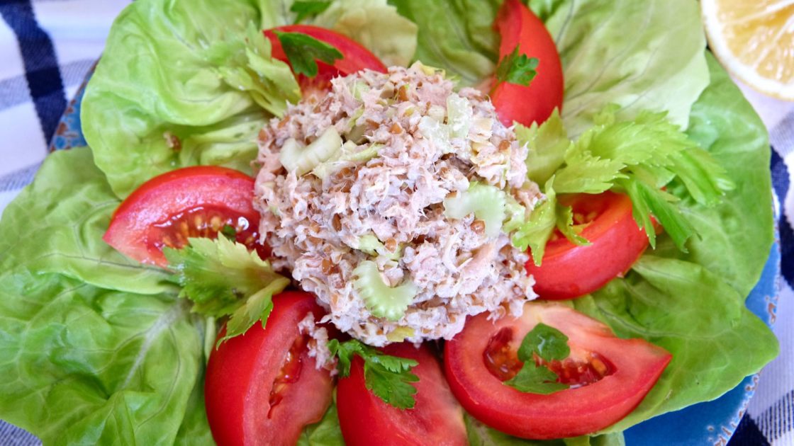 Tuna Salad on overlay of butter-leaf lettuce and tomato wedges