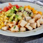 Quinoa and Black Bean Salad with chopped chicken, vegetables and mango