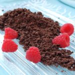 Chocolate Sand on ice-glass dish with raspberries