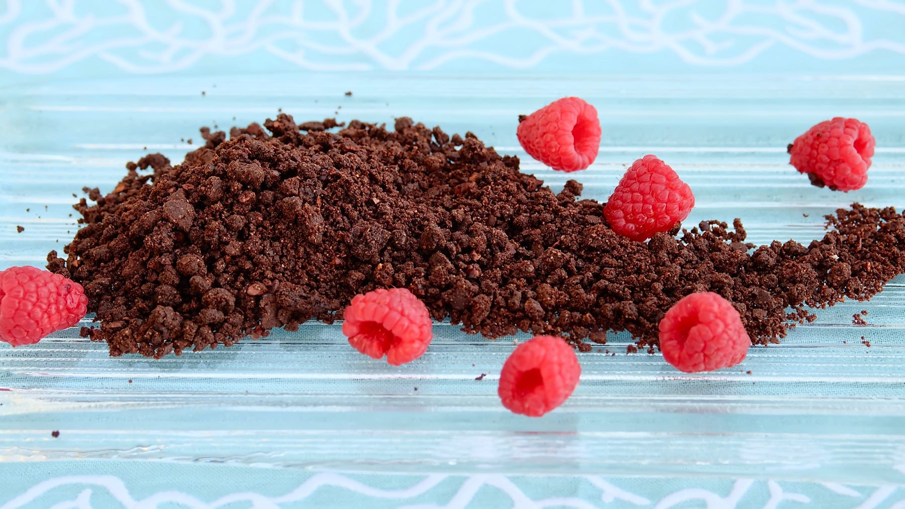 Chocolate Sand on Ice Glass garnished with Fresh Raspberries
