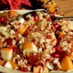 Bountiful Harvest Grain Salad in green serving bowl on gold linen