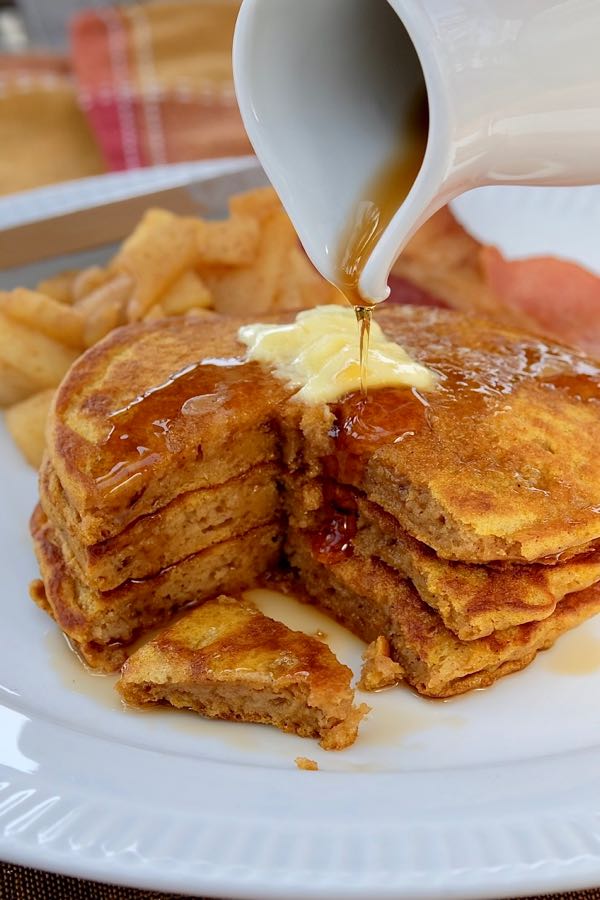 Fluffy Pumpkin Spice Pancakes served with Sauteed Cinnamon Apples and maple syrup