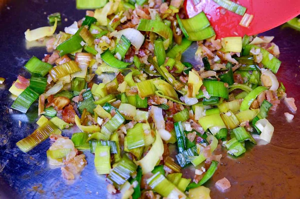 Leek, bacon and garlic sauteing in small pan until limp.