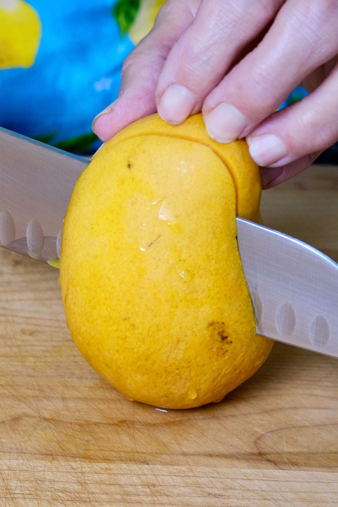 Atualfo Mango being cut on maple board.